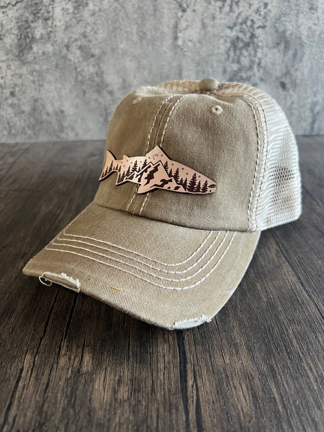 Front view of khaki unstructured cap with leather mountain fish patch