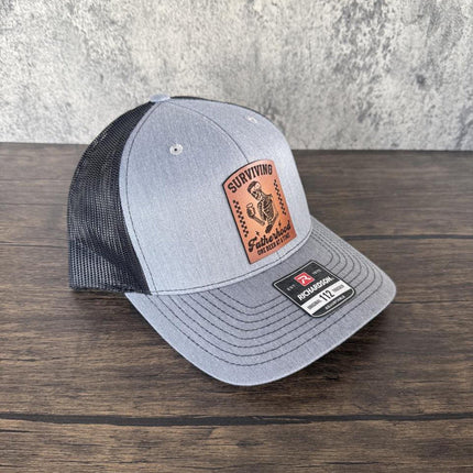 Surviving Fatherhood Hat, Leather Patch Dad Hat, Richardson 112 Trucker Cap, Funny Beer Dad Gift, Father's Day Hat - Patch Palooza